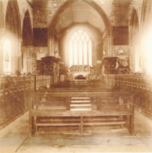 The old Nave showing benches in the central aisle